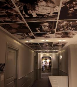 a hallway with a ceiling with pictures on it at Partenope Relais in Naples