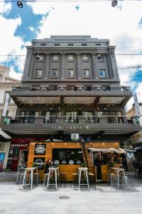 a large building with a lot of windows on top of it at Hotel Richmond on Rundle Mall in Adelaide