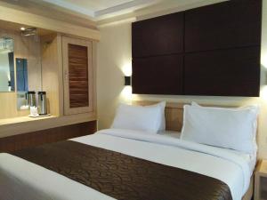 Darshan Hotel客房内的一张或多张床位
