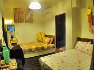 Letto o letti in una camera di Ku Shan Yuan Hotel