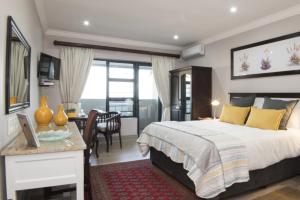 Ένα ή περισσότερα κρεβάτια σε δωμάτιο στο Hillside Guesthouse Umhlanga +50 φωτογραφίες