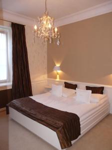 Postel nebo postele na pokoji v ubytování Boutiquehotel Oberkirch im Zentrum