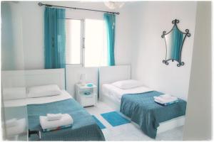 A bed or beds in a room at Sea front Villa Vera