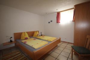 מיטה או מיטות בחדר ב-Appartementhaus Mentil