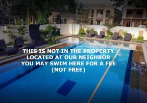 una cita sobre una piscina en un hotel en Sulit Budget Hotel near Dgte Airport Citimall en Dumaguete