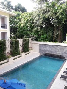 a swimming pool in the backyard of a house at Adema Boutique Karon in Karon Beach