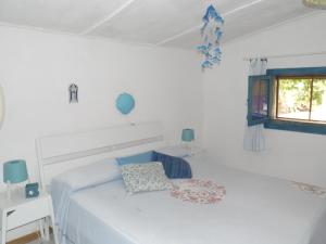 Capanna del Pescatoreにあるベッド