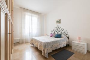 Posteľ alebo postele v izbe v ubytovaní Careggi Home