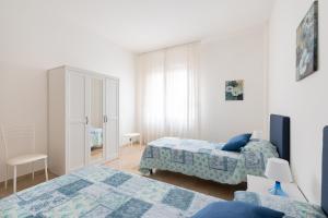 Posteľ alebo postele v izbe v ubytovaní Careggi Home + 8 fotografií