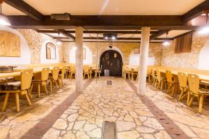 a large room with tables and chairs and a door at Holiday Home Juričko in Bizeljsko