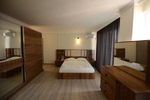 Postel nebo postele na pokoji v ubytování Hotel Aristocrat Batumi