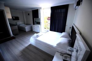 Postel nebo postele na pokoji v ubytování Hotel Aristocrat Batumi