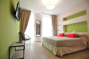 Katil atau katil-katil dalam bilik di Delco Naples