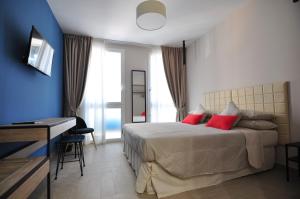 Ένα ή περισσότερα κρεβάτια σε δωμάτιο στο Delco Naples
