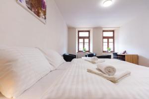 Katil atau katil-katil dalam bilik di Hotel Ungar