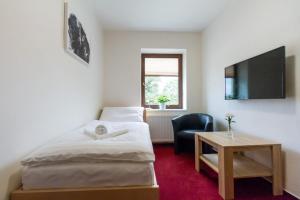 Een bed of bedden in een kamer bij Hotel Ungar