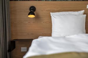 Katil atau katil-katil dalam bilik di KOMPAS Hotel Aalborg