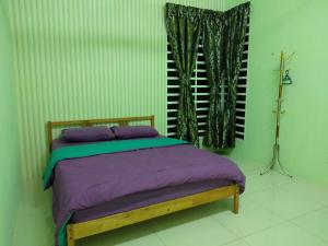 Katil atau katil-katil dalam bilik di Seri Homestay 293