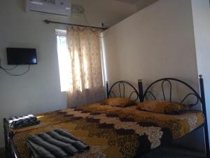 Postel nebo postele na pokoji v ubytování Stay Goa Guesthouse
