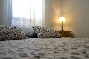 A bed or beds in a room at Casa del Arrabal