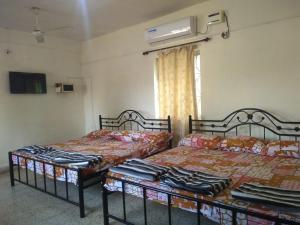 Voodi või voodid majutusasutuse Stay Goa toas