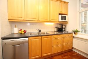 A kitchen or kitchenette at Tallinn City Apartments - Old Town