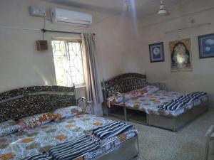 Postel nebo postele na pokoji v ubytování Stay Goa Guesthouse