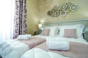 Ένα ή περισσότερα κρεβάτια σε δωμάτιο στο Santa Lucia B & B Suite
