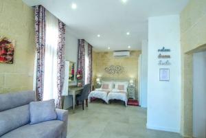 Ένα ή περισσότερα κρεβάτια σε δωμάτιο στο Santa Lucia B & B Suite
