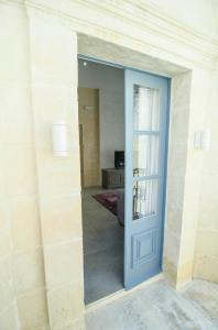 Ένα ή περισσότερα κρεβάτια σε δωμάτιο στο Santa Lucia B & B Suite