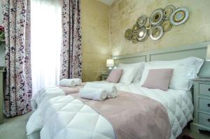 Postel nebo postele na pokoji v ubytování Santa Lucia B & B Suite