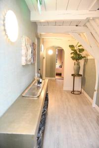 a kitchen with a counter top in a room at Hotel 't Fnidsen in Alkmaar