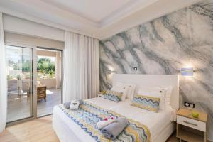 Säng eller sängar i ett rum på Belvedere Luxury Apartments & Spa