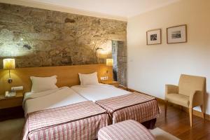 Giường trong phòng chung tại Hotel Rural de Charme Maria da Fonte