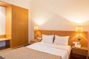 Giường trong phòng chung tại Hotel Rural de Charme Maria da Fonte