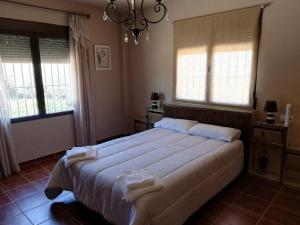 En eller flere senge i et værelse på Casa Rural Bellavista + 17 billeder