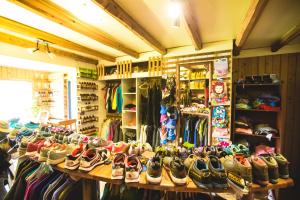 a store filled with lots of shoes on display at Kalfu Patagonia in Cochrane