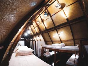 Кровать или кровати в номере Dahun Villas Siargao