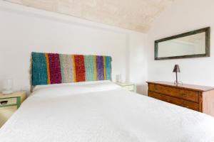 Trulli Masseria Donno Santo客房内的一张或多张床位