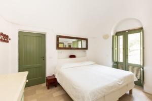 Trulli Masseria Donno Santo客房内的一张或多张床位