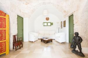 Trulli Masseria Donno Santo客房内的一张或多张床位