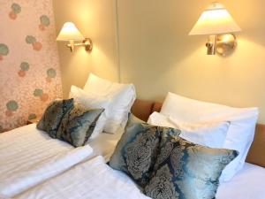 Hotel Rivoli Jardin tesisinde bir odada yatak veya yataklar