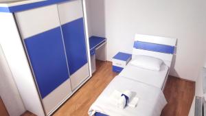 Voodi või voodid majutusasutuse Bus Station Hostel toas