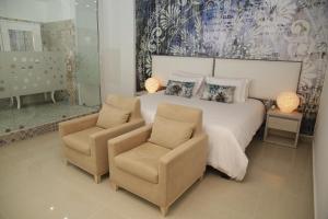 Voodi või voodid majutusasutuse HOTEL HABANA REAL toas