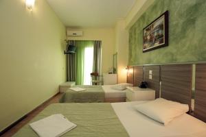Krevet ili kreveti u jedinici u okviru objekta Socrates Hotel