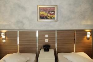 Krevet ili kreveti u jedinici u okviru objekta Socrates Hotel