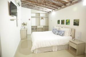 Voodi või voodid majutusasutuse HOTEL HABANA REAL toas
