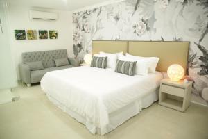 Giường trong phòng chung tại HOTEL HABANA REAL