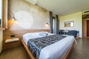 מיטה או מיטות בחדר ב-Hotel Gardenia