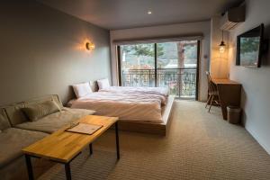 WPÜ HOTEL HAKONE客房内的一张或多张床位